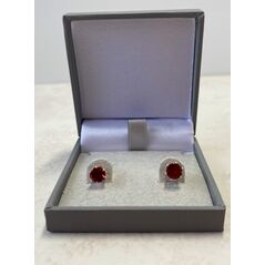 Sterling silver red garnet earrings in a box