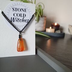 Carnelian crystal bound to black chain with black wire