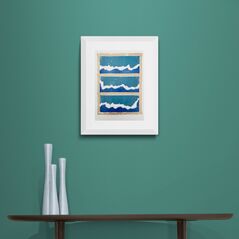 Blue White and Teal Waves Print in Framed in White on a Blue Wall Above Dark Shelf and Vase Set