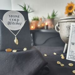 Small yellow citrine polished crystal on a dainty silver chain, bound using a simple silver wire wrap