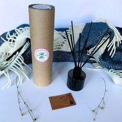 Orange blossom wild juniper and vanilla reed diffuser and packaging