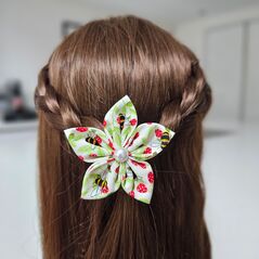 Handmade hair flower displayed in the hair